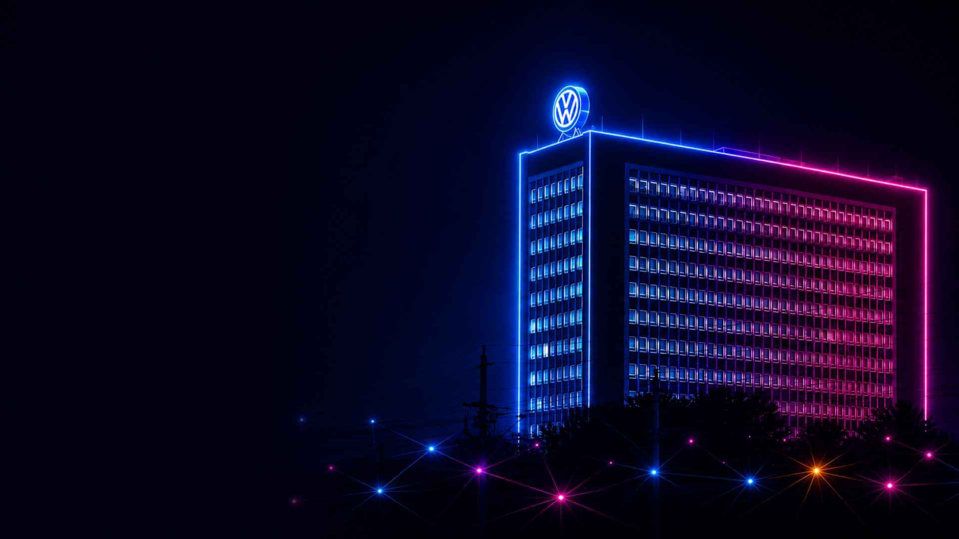Beleuchtetes Volkswagen-Hochhaus in Wolfsburg bei Nacht